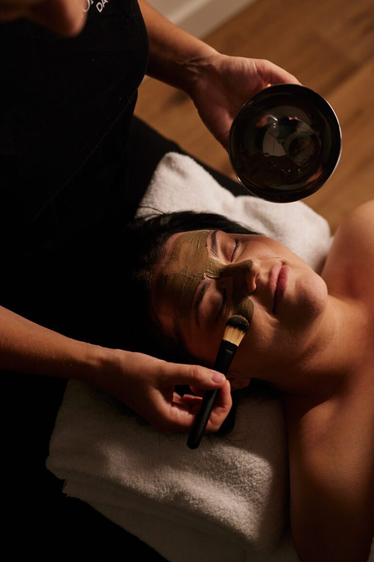 Woman gets facial at day spa