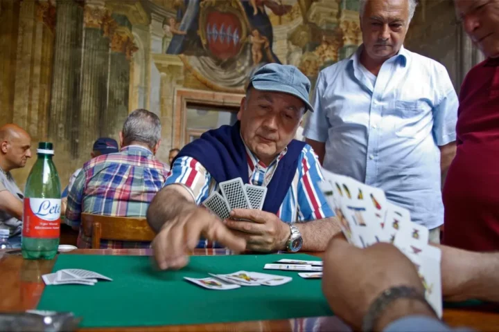 Italian men playing card game.