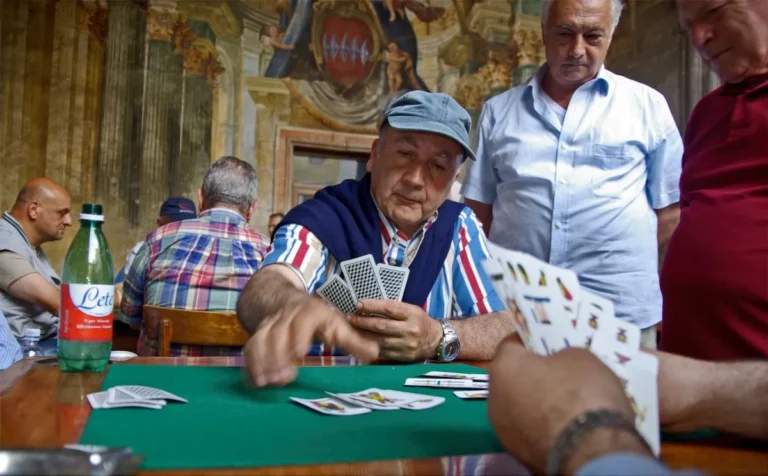 Italian men playing card game.